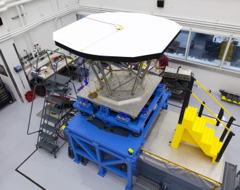Technicians at the Johns Hopkins University Applied Physics Laboratory in Laurel, Md., prepare an engineering model of the Solar Probe Plus Thermal Protection System, or TPS, for vibration tests in October 2013. The main feature of the TPS is an 8-foot-diameter, 4.5-inch-thick, carbon-carbon, carbon foam shield that will sit atop the Solar Probe Plus spacecraft body. The system will protect Solar Probe Plus from temperatures exceeding 2,500 degrees Fahrenheit and impacts from hypervelocity dust particles as it flies through the sun’s outer atmosphere. The vibration tests simulate the shaking the spacecraft will undergo during launch; Solar Probe Plus is scheduled to launch in 2018.