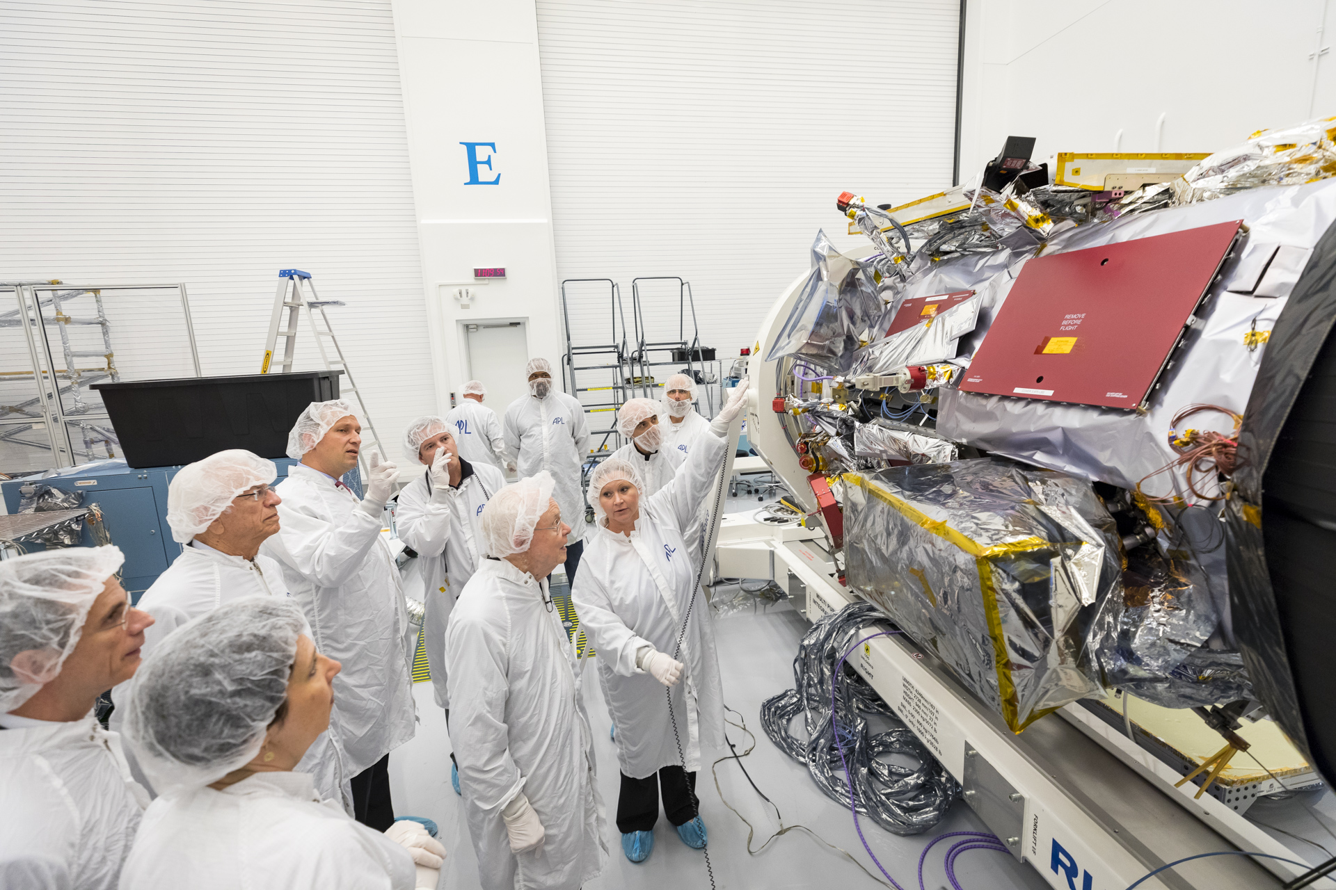 Eugene Parker, professor emeritus at the University of Chicago, visiting the spacecraft that bears his name: NASA’s Parker Solar Probe.  Engineers in the clean room at the Johns Hopkins Applied Physics Laboratory in Laurel, Maryland, where the probe was designed and is being built point out the instruments that will collect data as the mission travels directly through the Sun’s atmosphere. 