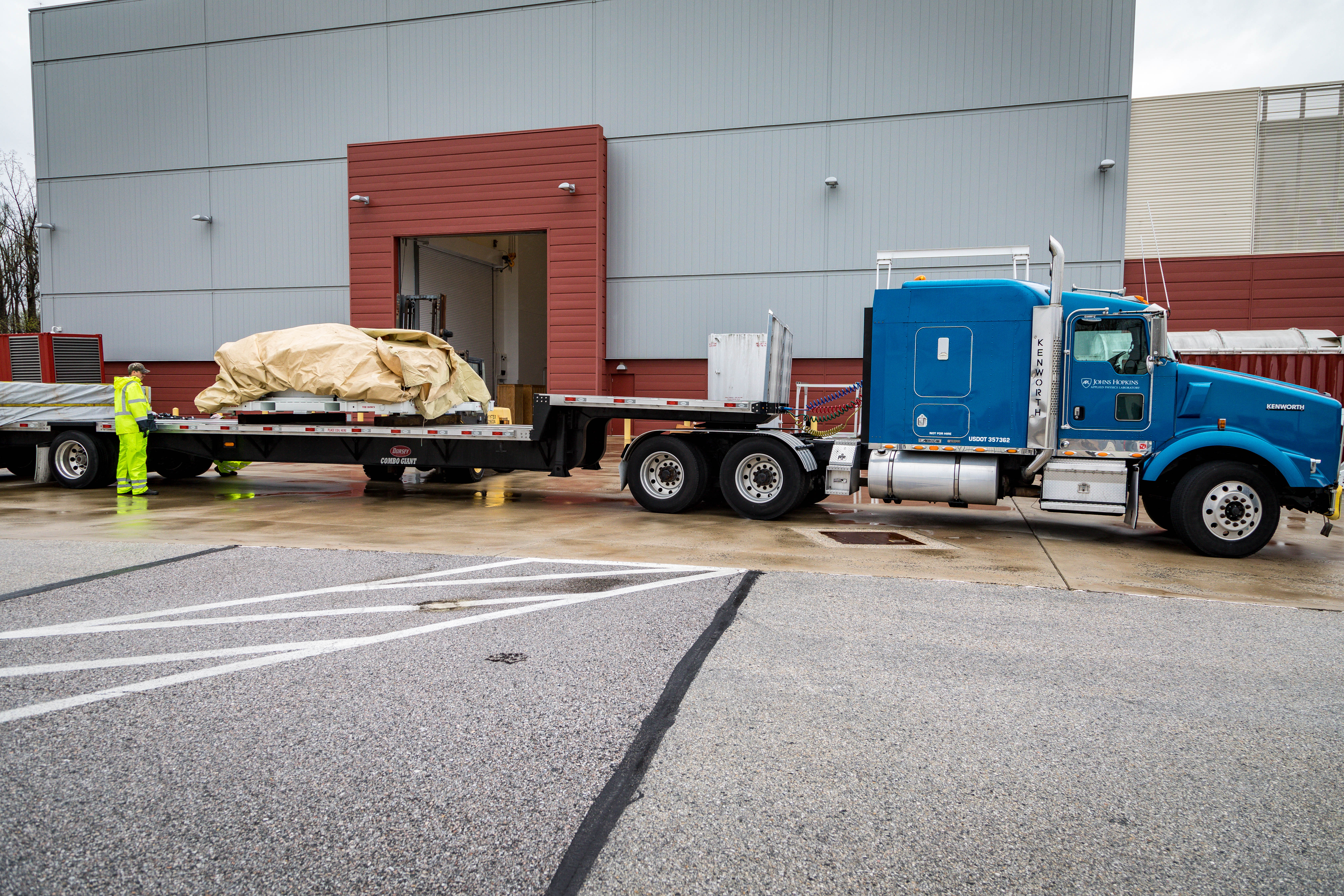 Parker Solar Probe’s heat shield – called the Thermal Protection System – departs from the Johns Hopkins Applied Physics Laboratory in Laurel, Maryland, on April 16, 2018. The heat shield traveled to Astrotech Space Operations in Titusville, Florida, on the flatbed of a truck, safely protected from the elements in its metal shipping container.