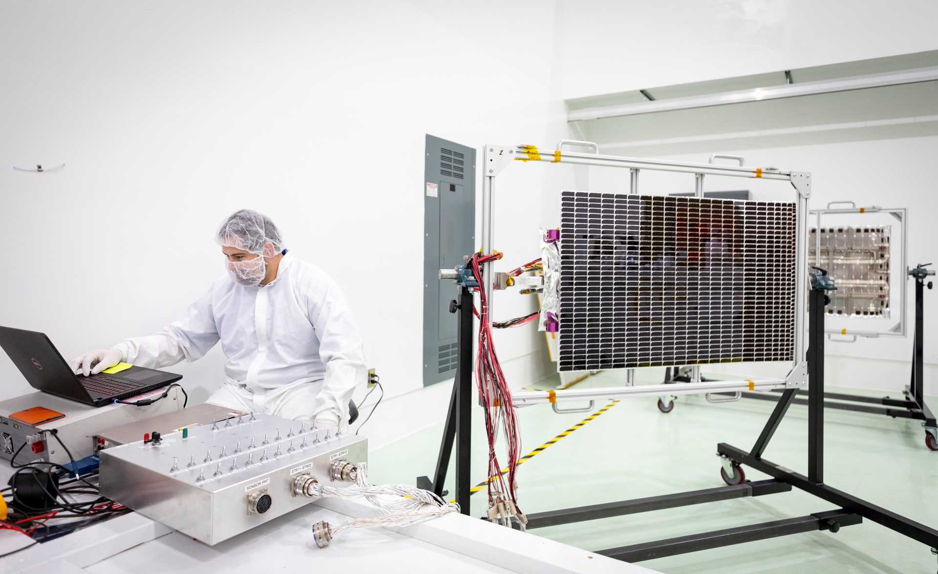 Andrew Gerger, an engineer from the Johns Hopkins Applied Physics Laboratory, prepares to conduct an inspection of one of the solar arrays from NASA’s Parker Solar Probe on May 2, 2018, at Astrotech Space Operations in Titusville, Florida. 