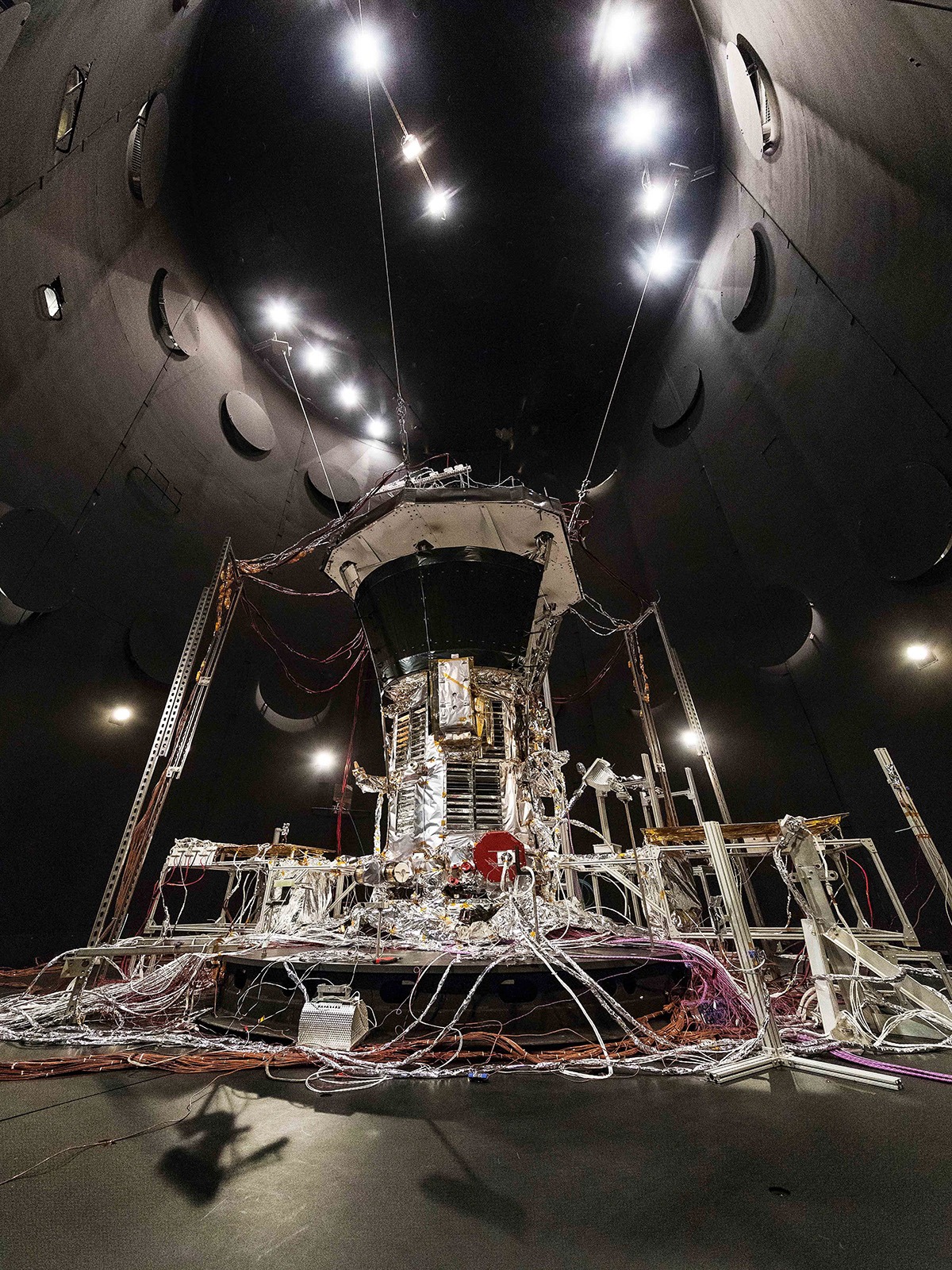 NASA’s Parker Solar Probe sits inside the thermal vacuum chamber at NASA’s Goddard Space Flight Center. On Jan. 27, the spacecraft began space environment testing inside the chamber, which simulates the hot and cold airless environments that the mission will experience during its mission to the Sun. 