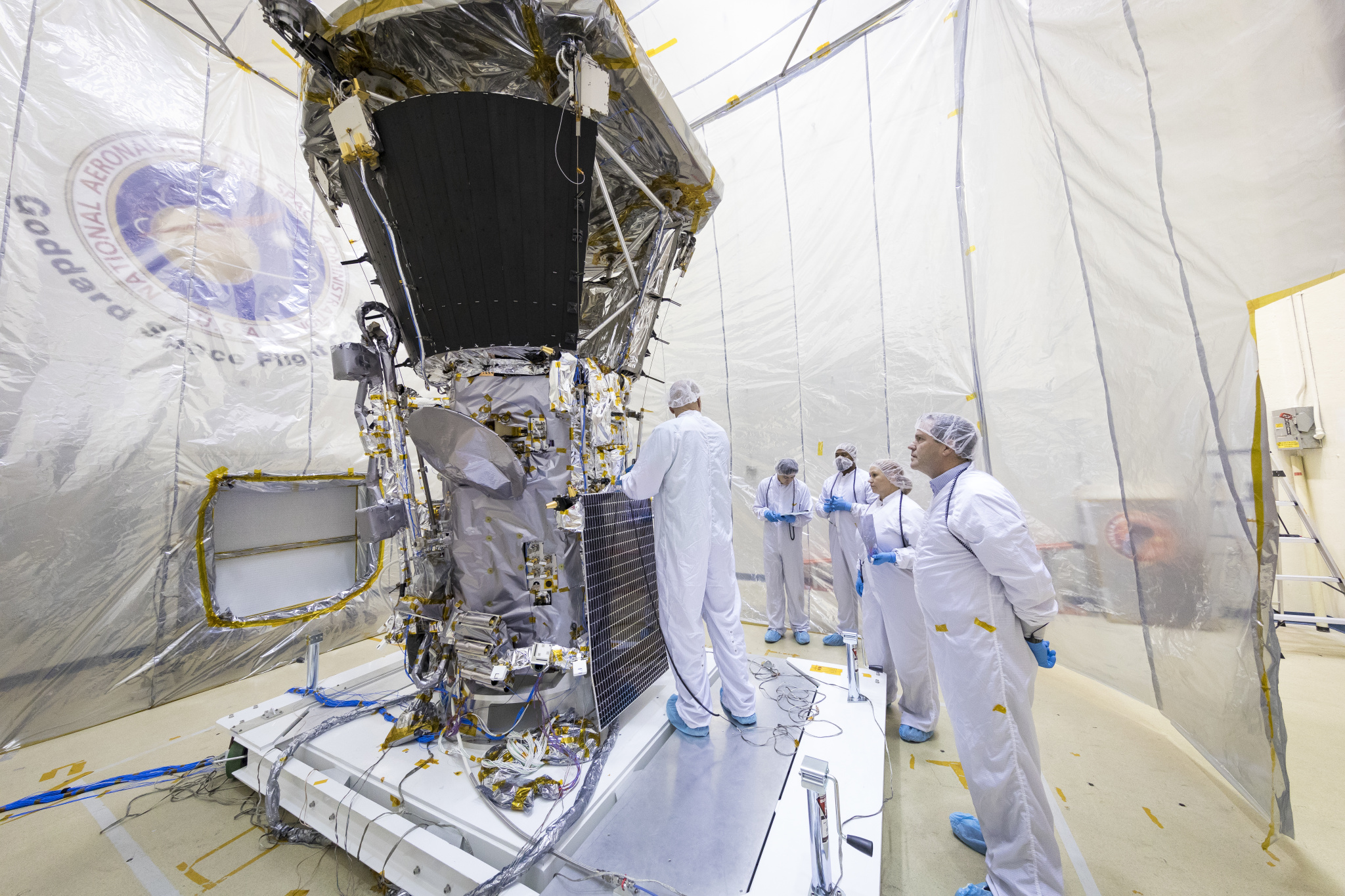 Members of the integration and testing team prepare Parker Solar Probe for environmental testing in the Acoustic Test Chamber at NASA’s Goddard Space Flight Center in Greenbelt, Maryland. 