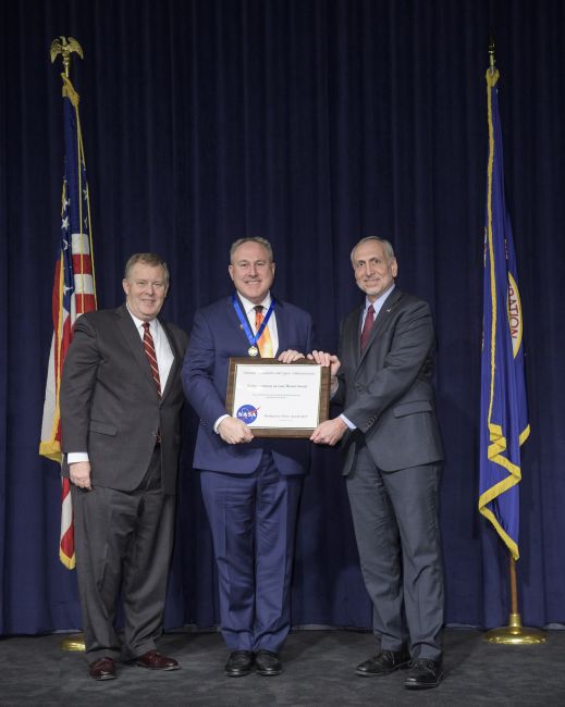 Andy Driesman of the Johns Hopkins Applied Physics Laboratory (center) receives the NASA Outstanding Public Leadership Medal for his role as project manager of Parker Solar Probe at a Nov. 5 ceremony at NASA Headquarters in Washington, D.C. At left is NASA Deputy Administrator Jim Morhard, with NASA Associate Administrator Steve Jurczyk at right.