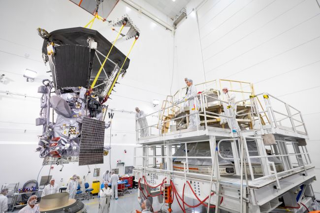 NASA’s Parker Solar Probe is lifted to the third stage rocket motor on July 11, 2018, at Astrotech Space Operations in Titusville, Florida. In addition to using the largest operational launch vehicle, the Delta IV Heavy, Parker Solar Probe will use a third stage rocket to gain the speed needed to reach the Sun, which takes 55 times more energy than reaching Mars.  