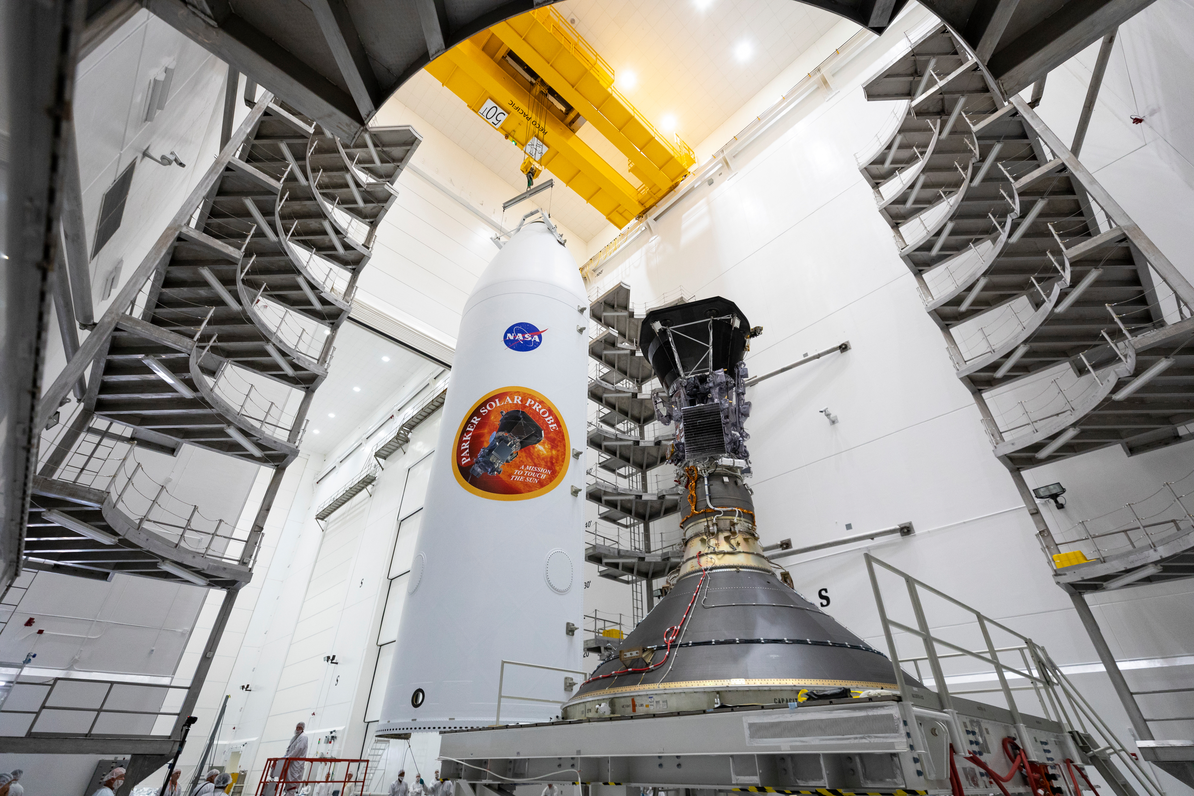 Parker Solar Probe, shown on July 16, 2018, is mounted atop its third stage rocket motor with one half of the 62.7-foot tall fairing that will encapsulate it. After encapsulation, the spacecraft will move from Astrotech Space Operations in Titusville, Florida to Space Launch Complex 37 on Cape Canaveral Air Force Station, where it will be integrated onto its launch vehicle, a United Launch Alliance Delta IV Heavy. 