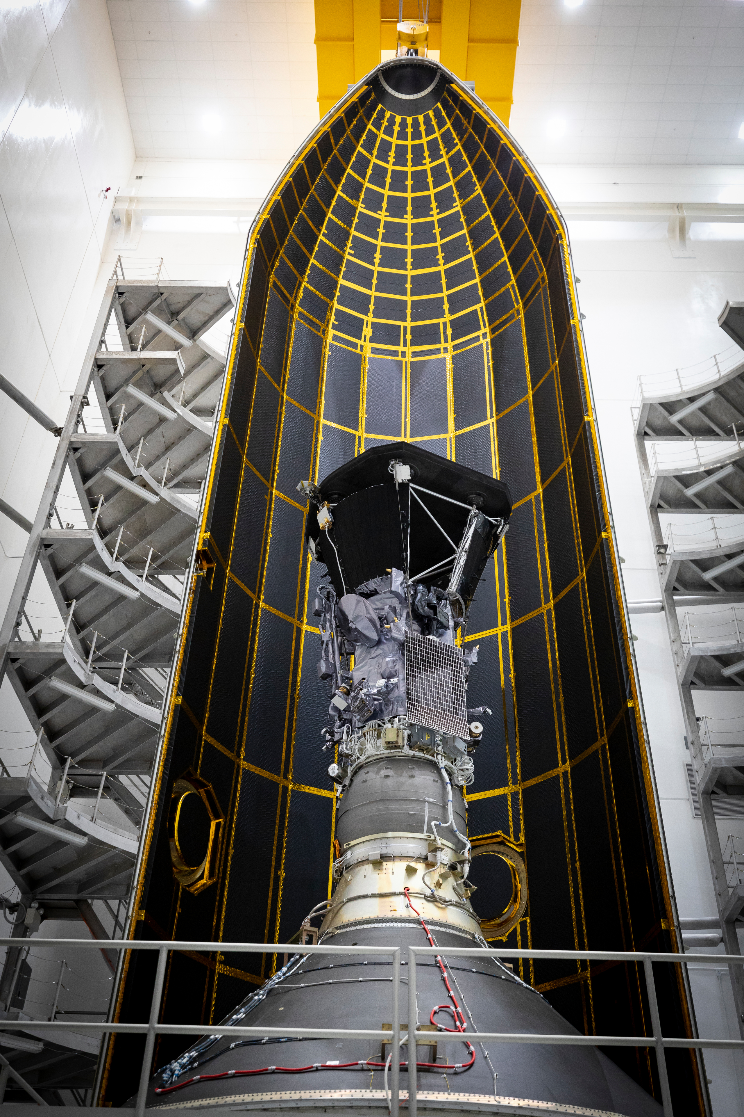 Seen here inside one half of its 62.7-foot tall fairing, NASA’s Parker Solar Probe was encapsulated on July 16, 2018, in preparation for the move from Astrotech Space Operations in Titusville, Florida to Space Launch Complex 37 on Cape Canaveral Air Force Station, where it will be integrated onto its launch vehicle, a United Launch Alliance Delta IV Heavy. 