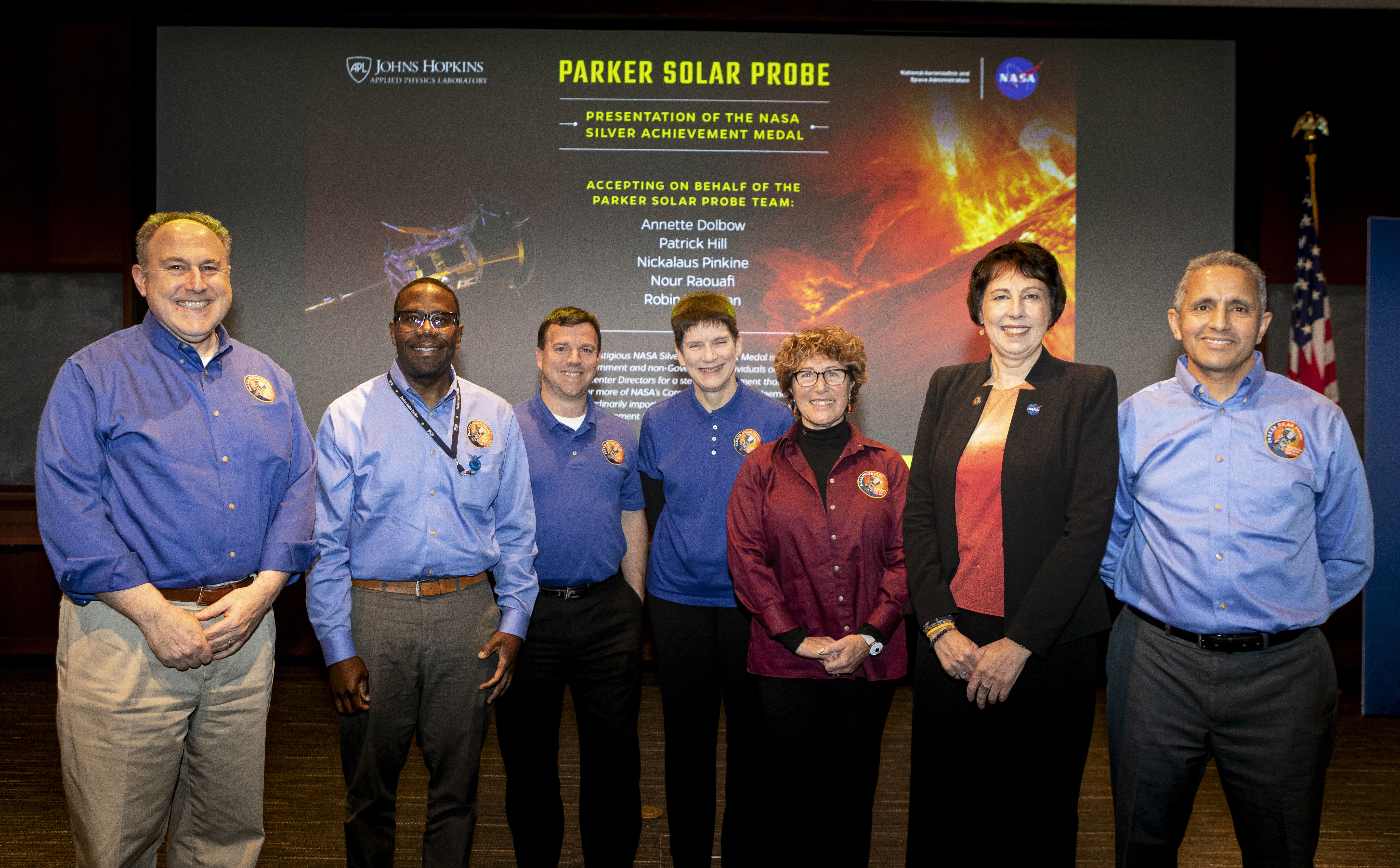 The Parker Solar Probe mission team at the Johns Hopkins Applied Physics Laboratory was awarded the NASA Silver Achievement Medal on Nov. 12 for “stellar achievement in the successful development, launch, and commissioning of the Parker Solar Probe, NASA’s coolest, hottest mission.” Pictured left to right: Andy Driesman, APL, previous project manager; Patrick Hill, APL, current project manager; Nickalaus Pinkine, APL, mission operations manager; Robin Vaughn, APL, spacecraft system engineer; Annette Dolbow, APL, integration and testing lead engineer; Nicky Fox, NASA Heliophysics Division director; and Nour Raouafi, APL, project scientist. 