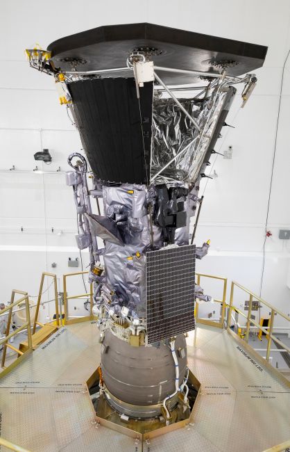 NASA’s Parker Solar Probe is shown here mated to its third stage rocket motor on July 16, 2018, at Astrotech Space Operations in Titusville, Florida. The Solar Array Cooling System uses large black radiators, at the top of the spacecraft, to cool water that flows through portions of the solar arrays, bottom left. 
