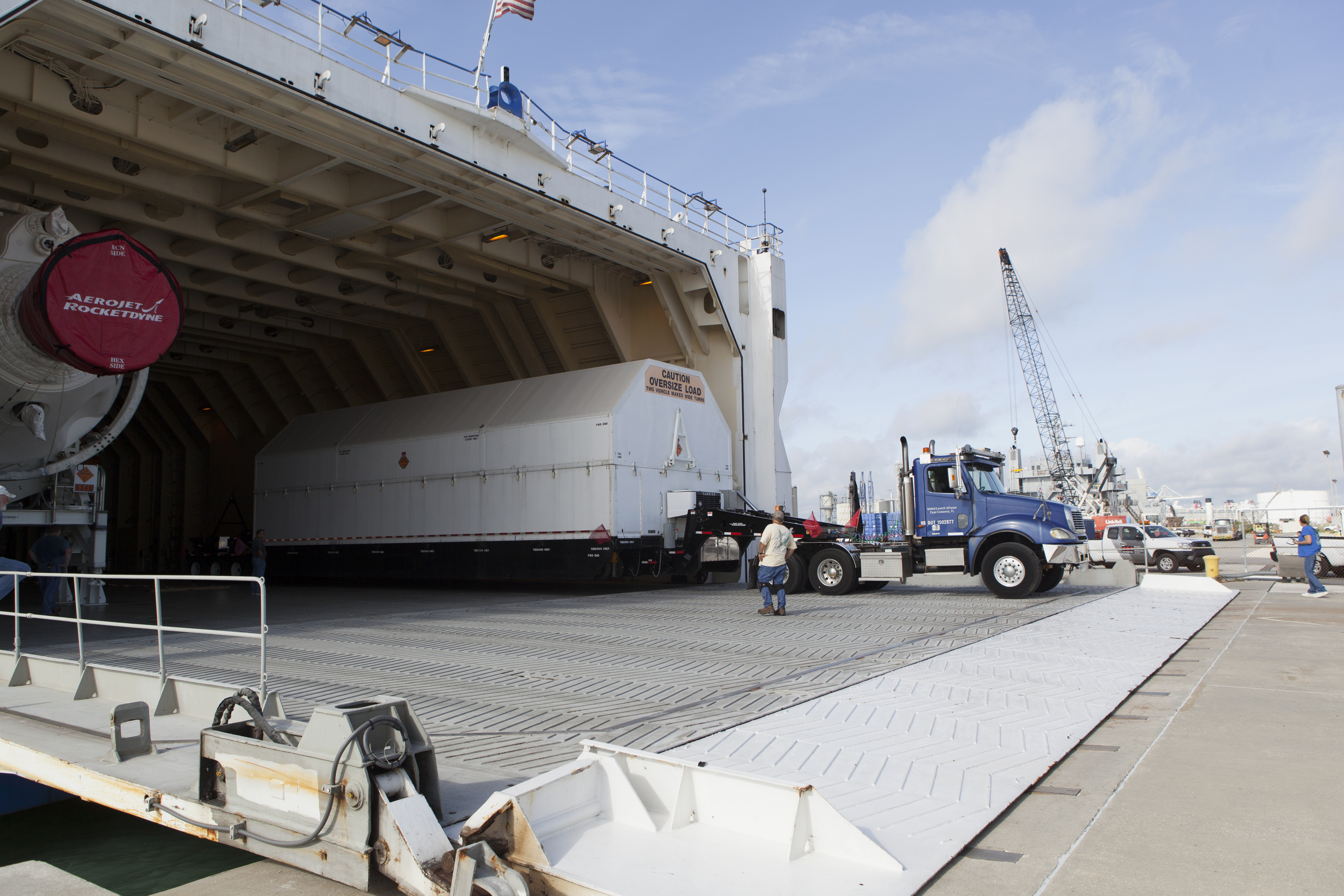 The Port Common Booster Core of the Delta IV Heavy for the Parker Solar Probe Mission is offloaded from the Mariner ship for transport to the Horizontal Integration Facility at Space Launch Complex 37.
