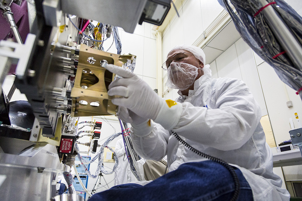 Neal Bachtell, of the Space Exploration Sector, adjusts the bracket for the Energetic Particle Instrument-Low Energy (EPI-Lo) on the Solar Probe Plus spacecraft on April 17, 2017. EPI-Lo is the first of several science instruments set for installation on the NASA spacecraft, scheduled to launch in July 2018 on an unprecedented, close-up study of the sun.