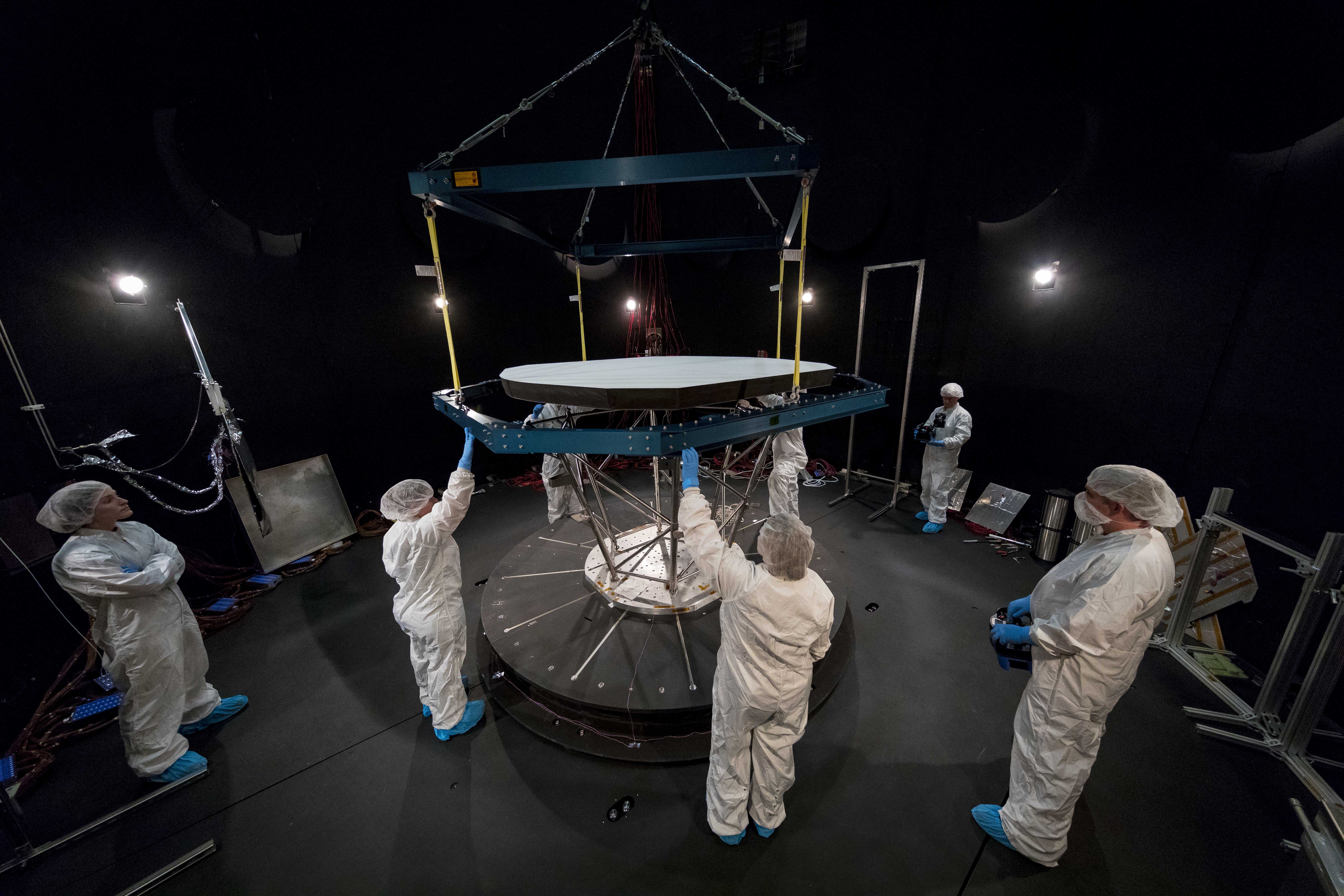 Parker Solar Probe's Thermal Protection System (TPS) is lowered into the Thermal Vacuum Chamber at NASA's Goddard Space Flight Center in preparation for environmental testing. 