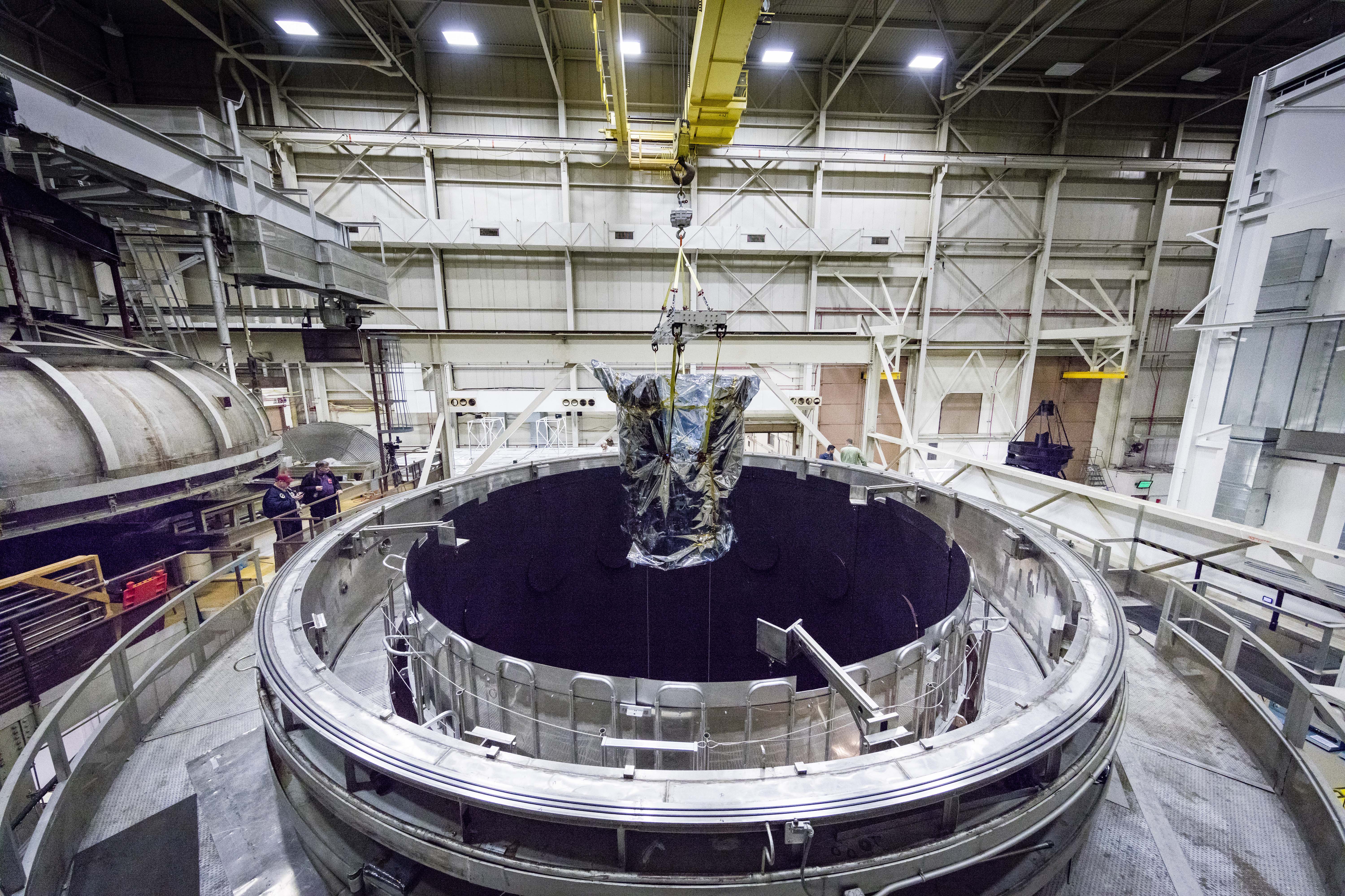 Parker Solar Probe is lifted out of the Space Environment Simulator at NASA’s Goddard Space Flight Center in Greenbelt, Maryland, on March 24, 2018. The spacecraft has spent eight weeks undergoing space environment testing in the thermal vacuum chamber. After about seven more days of testing outside the chamber, Parker Solar Probe will travel to Florida for a scheduled launch on July 31, 2018, from NASA’s Kennedy Space Center in Cape Canaveral. 